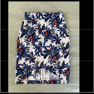 Jealous tomato skirt. Has an asymmetrical front and zipper in the back. Floral